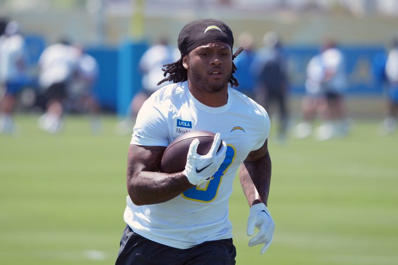 May 19, 2026; El Segundo, CA, USA; Los Angeles Chargers running back Omarion Hampton (8) carries the ball during offseason workouts at The Bolt. Mandatory Credit: Kirby Lee-Imagn Images