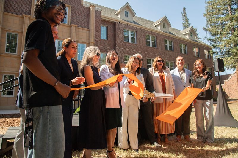 Dignitaries participate in a ribbon cutting ceremony for the newly rebuilt Southwest Hall on the Pacific campus in Stockton on Aug. 11, 2026.