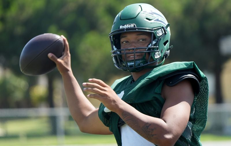 Pacifica quarterback Taylor Lee eyes the target before letting a pass fly during a practice on Aug. 10, 2026, at Pacifica High.