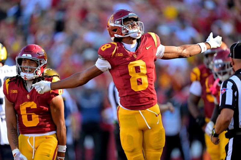 Oct 11, 2025; Los Angeles, California, USA;  USC Trojans wide receiver Ja'Kobi Lane (8) celebrates after a touchdown in the first half against the Michigan Wolverines at United Airlines Field at the Los Angeles Memorial Coliseum. Mandatory Credit: Jayne Kamin-Oncea-Imagn Images