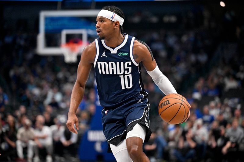 Feb 27, 2026; Dallas, Texas, USA; Dallas Mavericks guard Brandon Williams (10) brings the ball up court against the Memphis Grizzlies during the first quarter at the American Airlines Center. Mandatory Credit: Jerome Miron-Imagn Images