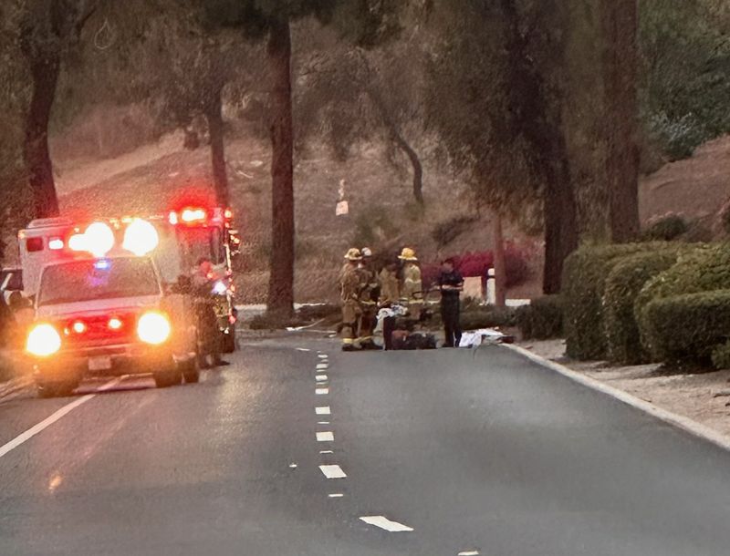 First responders attend to a motorcyclist who crashed on Santa Rosa Road in Camarillo Aug. 10. The man was pronounced dead at the scene.