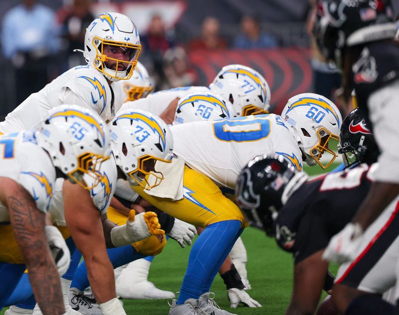 Aug 13, 2026; Houston, Texas, USA; Los Angeles Chargers quarterback DJ Uiagalelei (7) under center against the Houston Texans in the second half at Reliant Stadium. Mandatory Credit: Thomas Shea-Imagn Images