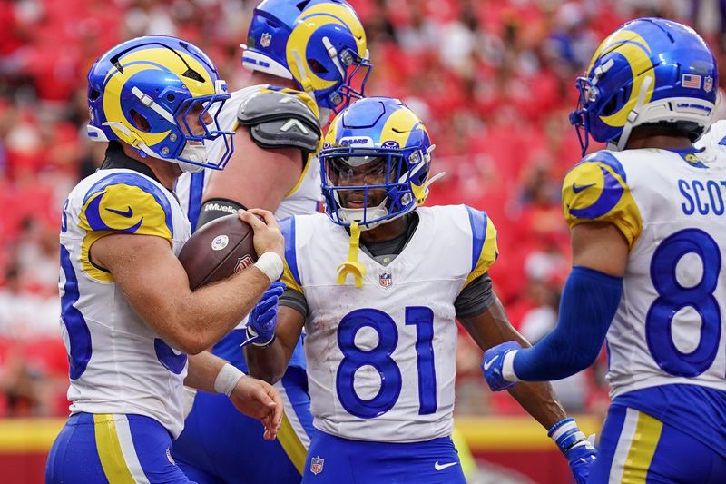 Aug 15, 2026; Kansas City, Missouri, USA; Los Angeles Rams running back Dean Connors (33) celebrates with wide receiver Brennan Presley (81) after scoring against the Kansas City Chiefs during the second half of the pre season game at Arrowhead Stadium. Mandatory Credit: Denny Medley-Imagn Images