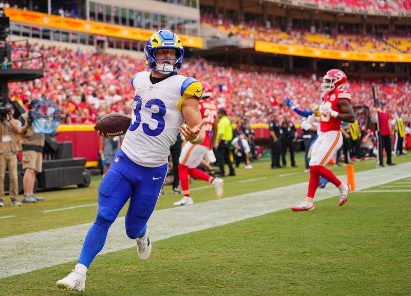 Aug 15, 2026; Kansas City, Missouri, USA; Los Angeles Rams running back Dean Connors (33) scores a touchdown during the second half against the Kansas City Chiefs at at Arrowhead Stadium. Mandatory Credit: Jay Biggerstaff-Imagn Images