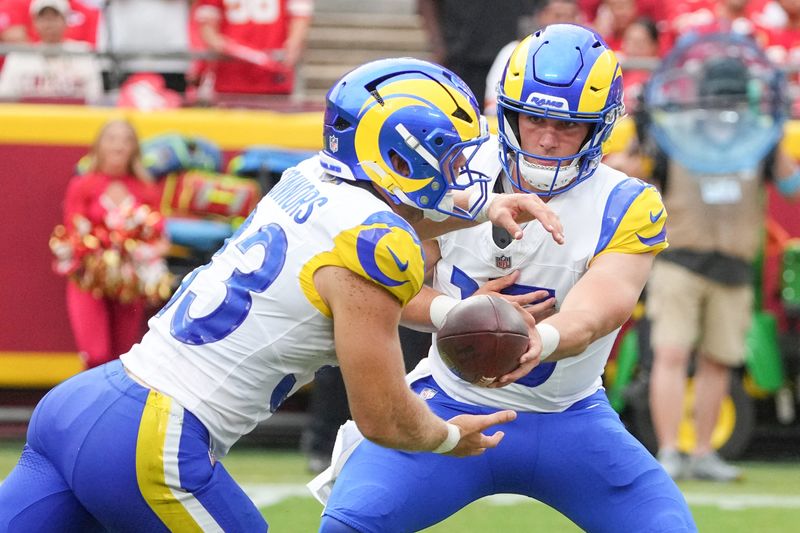 Aug 15, 2026; Kansas City, Missouri, USA; Los Angeles Rams quarterback Ty Simpson (15) hands off to running back Dean Connors (33) against the Kansas City Chiefs during the second half of the pre season game at Arrowhead Stadium. Mandatory Credit: Denny Medley-Imagn Images