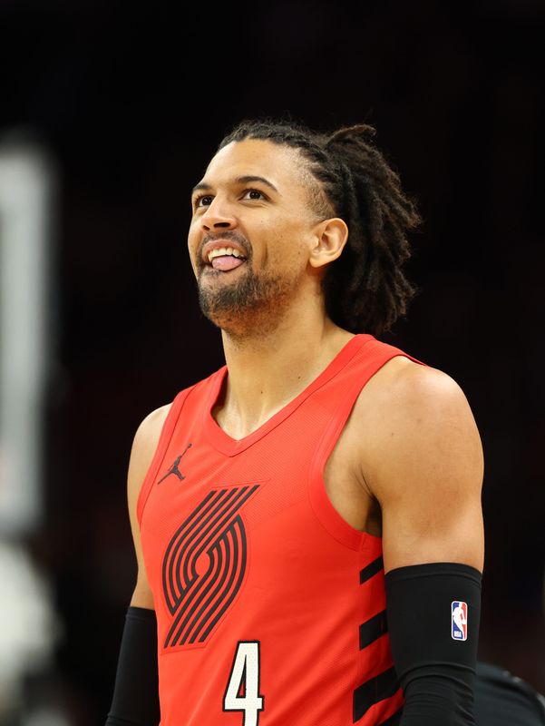 Feb 22, 2026; Phoenix, Arizona, USA; Portland Trail Blazers guard Matisse Thybulle (4) against the Phoenix Suns at Mortgage Matchup Center. Mandatory Credit: Mark J. Rebilas-Imagn Images