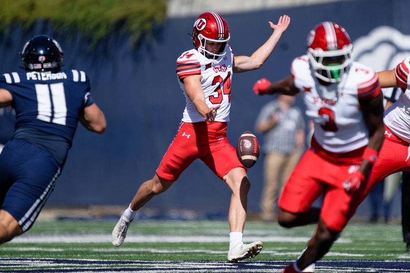 Sep 14, 2024; Logan, Utah, USA;  Utah Utes punter Jack Bouwmeester (34) punts against the Utah State Aggies at Merlin Olsen Field at Maverik Stadium. Mandatory Credit: Jamie Sabau-Imagn Images