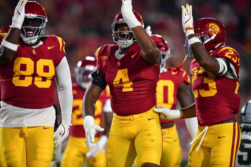 Sep 20, 2025; Los Angeles, California, USA; Southern California Trojans defensive end Jahkeem Stewart (4) reacts after a defensive play against the Michigan State Spartans during the first half at the Los Angeles Memorial Coliseum. Mandatory Credit: Gary A. Vasquez-Imagn Images
