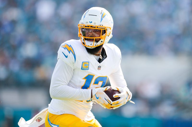 Nov 16, 2025; Jacksonville, Florida, USA; Los Angeles Chargers wide receiver Keenan Allen (13) catches a pass against the Jacksonville Jaguars during the second quarter at EverBank Stadium. Mandatory Credit: Nathan Ray Seebeck-Imagn Images