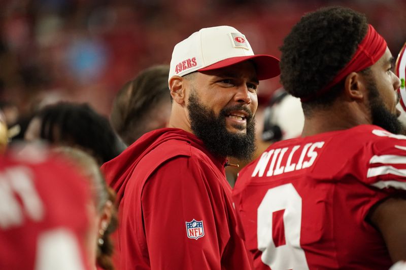 Aug 13, 2026; Santa Clara, California, USA;  San Francisco 49ers wide receiver Mike Evans (5) watches from the sideline during a game against the Tennessee Titans in the fourth quarter at Levi's Stadium. Mandatory Credit: David Gonzales-Imagn Images