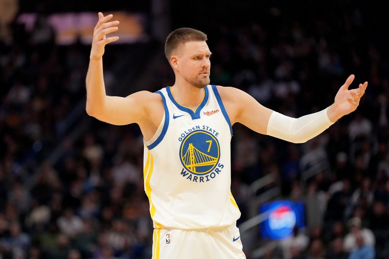 Mar 13, 2026; San Francisco, California, USA; Golden State Warriors forward Kristaps Porzingis (7) reacts after being fouled against the Minnesota Timberwolves in the fourth quarter at the Chase Center. Mandatory Credit: Cary Edmondson-Imagn Images