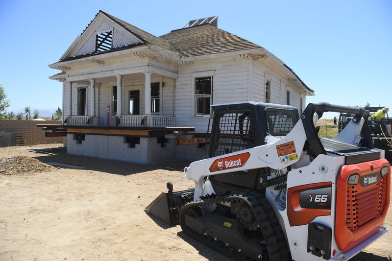 The over 130-year-old Scholle farmhouse sits at its new site in Camarillo before being lowered onto its new foundation on Aug. 19.
