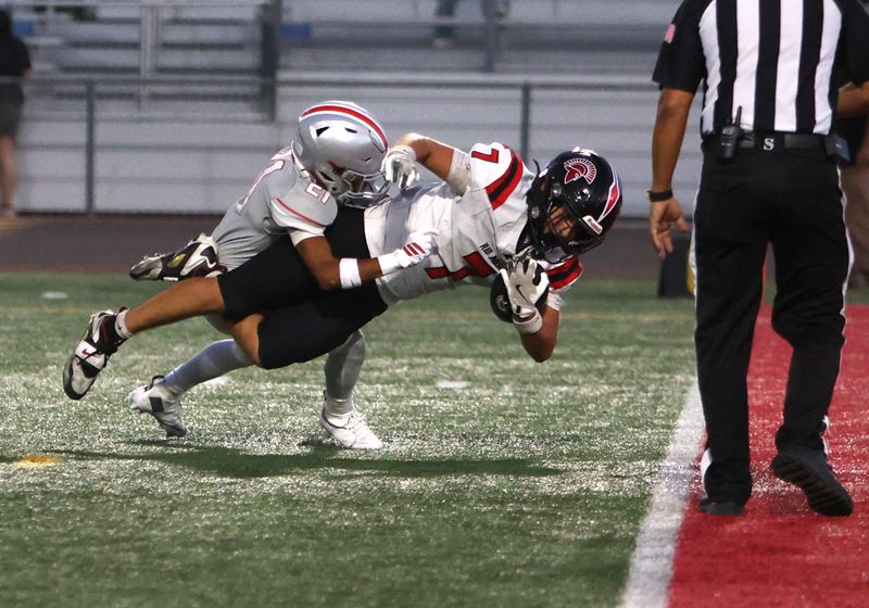 Rio Mesa's Adrian Delatorre scores a touchdown while being tackled by Hueneme's Westley Hernandez during the second quarter of a season-opening game on Friday, Aug. 21, 2026, at Hueneme High's Andy McEuen Stadium. Rio Mesa won 51-13.