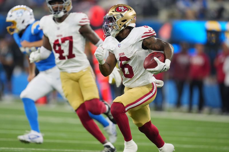 Aug 20, 2026; Inglewood, California, USA; San Francisco 49ers safety Malik Mustapha (6) carries the ball on an 83-yard punt return against the Los Angeles Chargers in the first half at SoFi Stadium. Mandatory Credit: Kirby Lee-Imagn Images