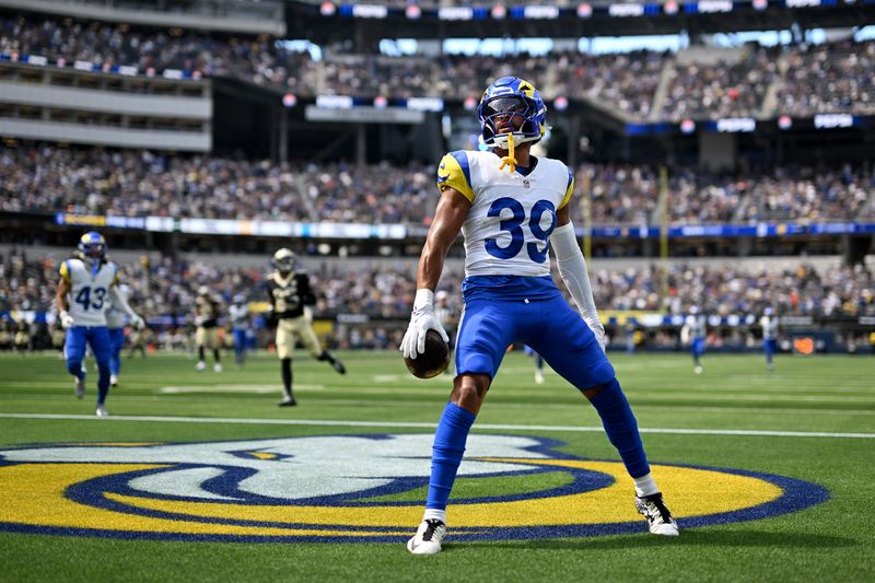 Aug 22, 2026; Inglewood, California, USA;  Los Angeles Rams safety Alex Cook (39) celebrates after scoring a touchdown against the New Orleans Saints during the third quarter at SoFi Stadium.  Mandatory Credit: Griffin Hooper-Imagn Images
