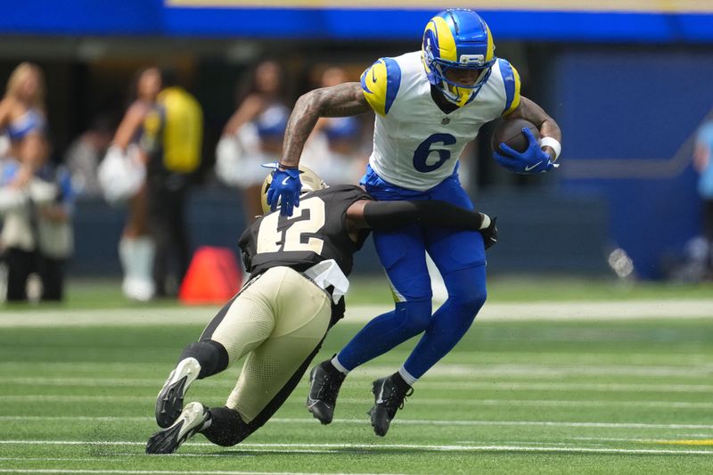 Aug 22, 2026; Inglewood, California, USA; Los Angeles Rams wide receiver CJ Daniels (6) carries the ball against 
42 in the first half at SoFi Stadium. Mandatory Credit: Kirby Lee-Imagn Images
