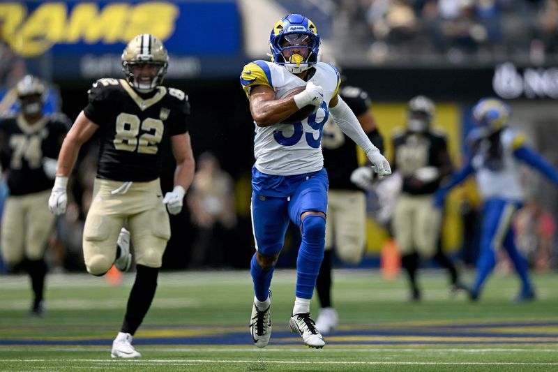 Aug 22, 2026; Inglewood, California, USA;  Los Angeles Rams safety Alex Cook (39) intercepts a pass and runs for a touchdown against the New Orleans Saints during the third quarter at SoFi Stadium.  Mandatory Credit: Griffin Hooper-Imagn Images