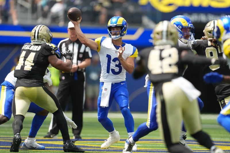Aug 22, 2026; Inglewood, California, USA; Los Angeles Rams quarterback Stetson Bennett IV (13) throws the ball against the New Orleans Saints in the first half at SoFi Stadium. Mandatory Credit: Kirby Lee-Imagn Images