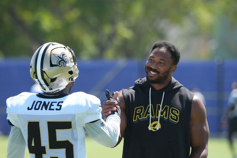 Aug 20, 2026; Woodland Hills, CA, USA; Los Angeles Rams defensive end Myles Garrett with New Orleans Saints linebacker Deion Jones (45) during a joint practice at Rams Practice Facility. Mandatory Credit: Kirby Lee-Imagn Images