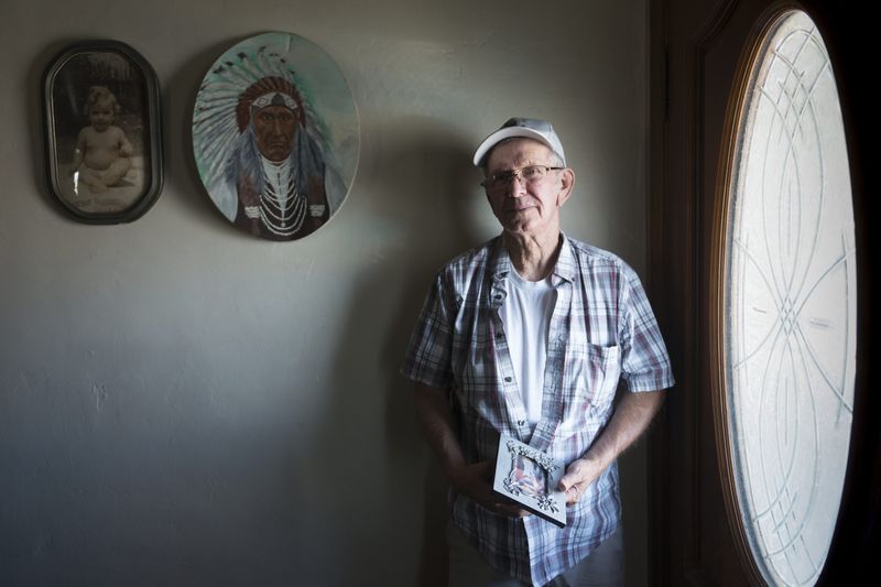 Michael Brooks Sr. stands inside his home in Apple Valley, just a few feet from where his son Michael Anthony Brooks was found shot to death in 2016.