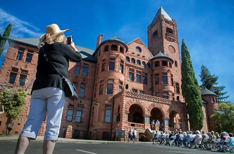 Debra Reeve of Sacramento takes a picture of the historic Preston Castle in Ione during its 125th anniversary celebration in 2019.