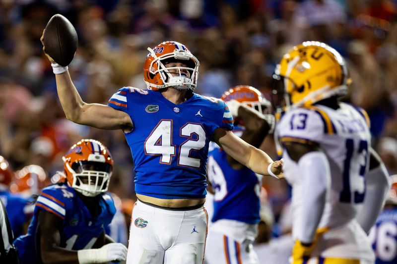 Florida Gators long snapper Rocco Underwood (42) celebrates after recovering a loose ball during the first half against the LSU Tigers at Steve Spurrier Field at Ben Hill Griffin Stadium in Gainesville, FL on Saturday, October 15, 2022. [Matt Pendleton/Gainesville Sun]