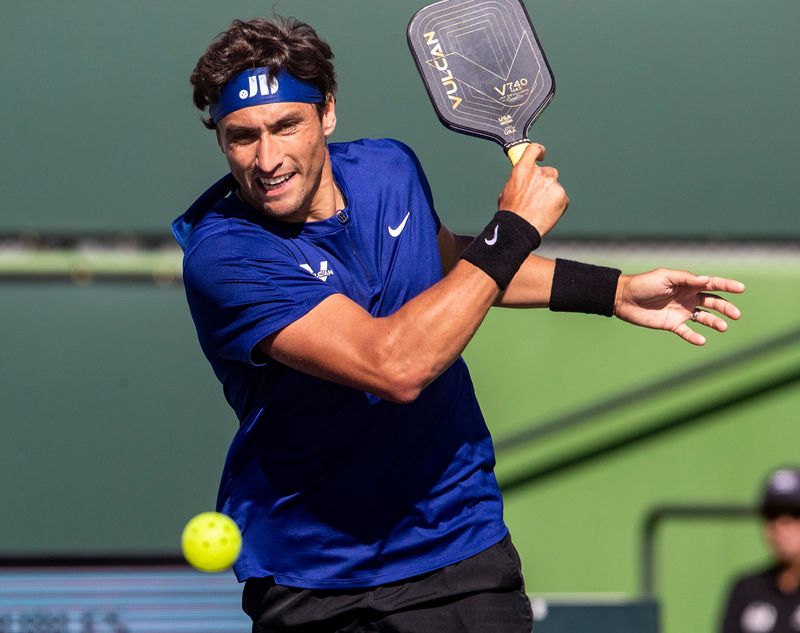 Professional pickleball player Jay Devilliers returns a shot during the mens doubles semifinals of the Margaritaville USA Pickleball National Championships at the Indian Wells Tennis Garden in Indian Wells, Calif., Saturday, Nov. 12, 2022.