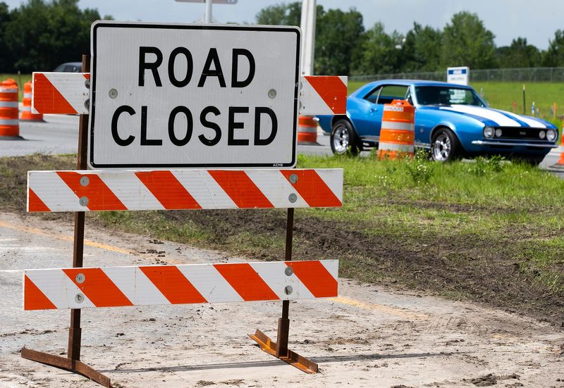 Florida Department of Transportation had traffic detoured around the intersection of SE 58th Avenue and SE Dogwood Road near the land fill at the Marathon gas station Monday morning, June 8, 2020. A sink hole opened up early Sunday morning due to the heavy rains that Marion County experienced over the weekend. [Doug Engle/Ocala Star-Banner]2020