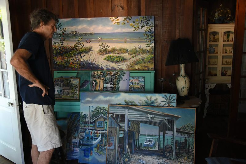 Paul Arsenault at home with some of his paintings. The Rookery Bay Environmental Learning Center is hosting a show by longtime Naples artist Paul Arsenault, featuring vintage works as well as paintings from a new “For the Love of Water” collection, from May to July 28.