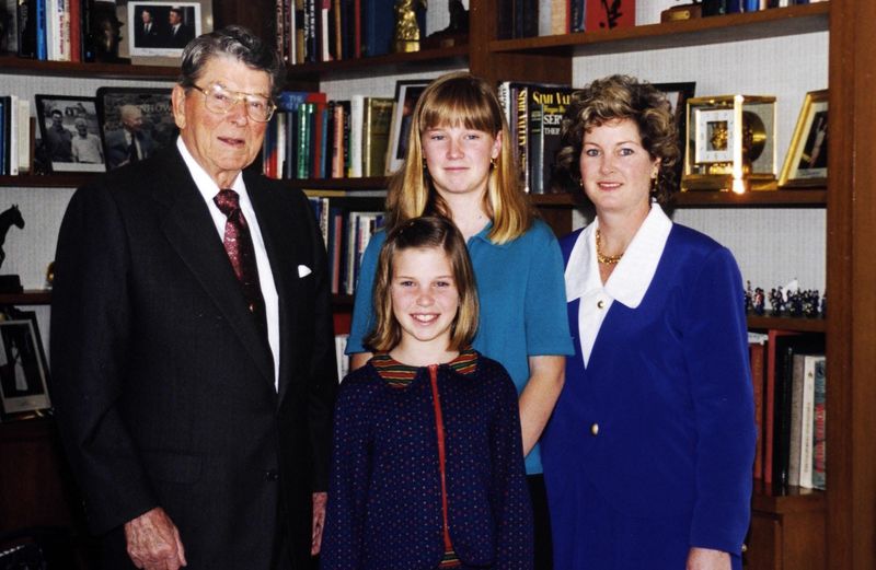 In March 1998, Former President Ronald Reagan is shown in his office in Century City, California, with Susie Wiles and her two daughters, Katie Wiles, 14, and Caroline Wiles, 11. Wiles worked for Reagan during his campaign, White House years and after.