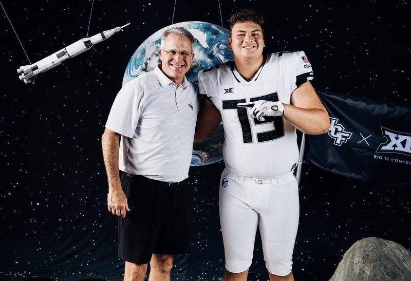 Benjamin offensive tackle Chase Malamala poses with UCF head coach Gus Malzahn during his official visit in 2023.