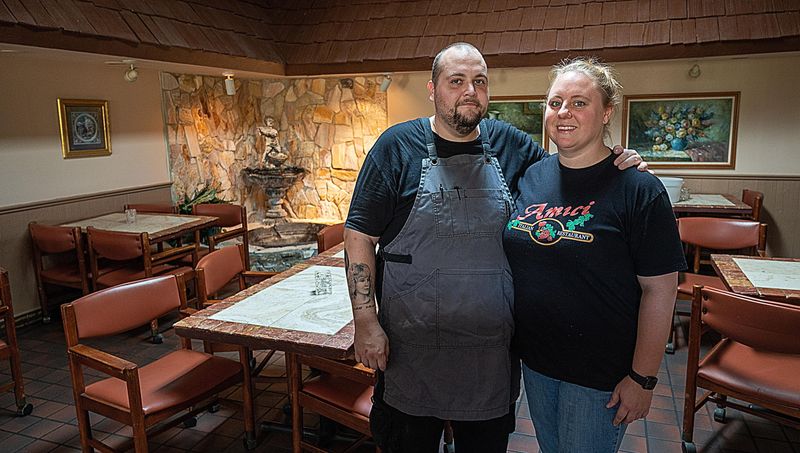 Amici Italian Restaurant owners Freddy and Jenn Underhill are shown in their restaurant in April 2020.