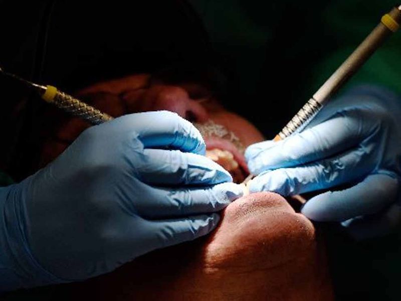 University of Southern Indiana dental hygienist at work Monday as the USI Dental Hygiene Clinic offers free dental cleanings for veterans, Monday, Feb. 29, 2016.