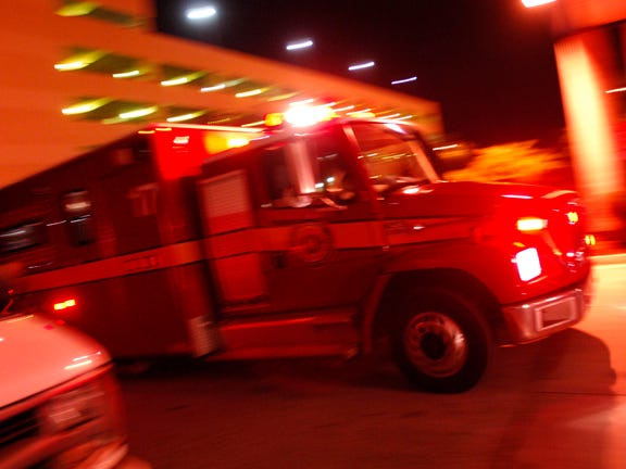 A Jacksonville Fire/Rescue ambulance rushes to the Emergency entrance at then-named Shands Jacksonville.