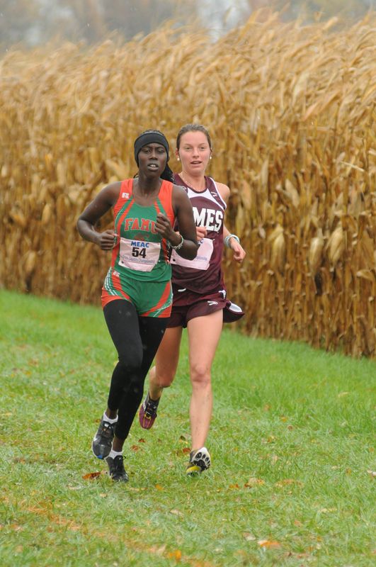 Judith Kibii (left) passes a runner from Maryland-Eastern Shore during the MEAC cross country championships in Delaware. Kibii finished second in the race.