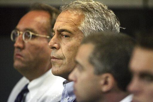 Jeffrey Epstein, center, at a West Palm Beach court appearance in July 2008.
