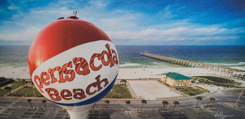 Allen Jones captures the hallowed Pensacola Beach fishing pier from the perspective of the iconic beach ball water tower. It’s on display at Atchison’s Gallery Gifts and Design.