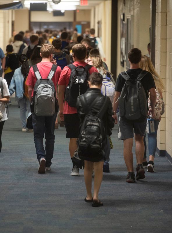 Students flood the hallways at Pace High School on Tuesday, Aug. 27, 2019.