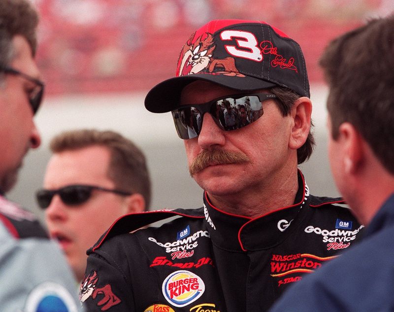 Dale Earnhardt stands along pit road during qualifying for the Daytona 500 at Daytona International Speedway on February 12, 2000.