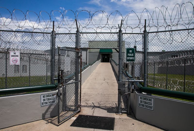 The entrance to the Marion County Jail Thursday afternoon, May 6, 2021. An extra layer of Concertina wire or razor wire, has been added to both the top and bottom of the perimeter fence that surrounds the Marion County Jail. Last year the Marion County Sheriff's Department budgeted $550,000 to replace or re-enforce the 6000 feet of fence and razor wire around the Marion County Jail after a former inmate tried to break in to the jail to free a fellow inmate. [Doug Engle/Ocala Star Banner]2021