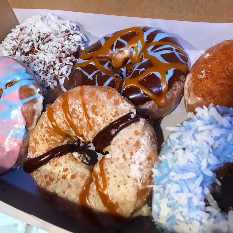 A box of Donut Kingdom doughnuts. The bakery closed it's North Monroe Street location in June 2025. Read more: https://www.tallahassee.com/story/entertainment/restaurants/2025/06/30/tallahassees-donut-kingdom-opening-new-location-on-magnolia-drive/84287544007/