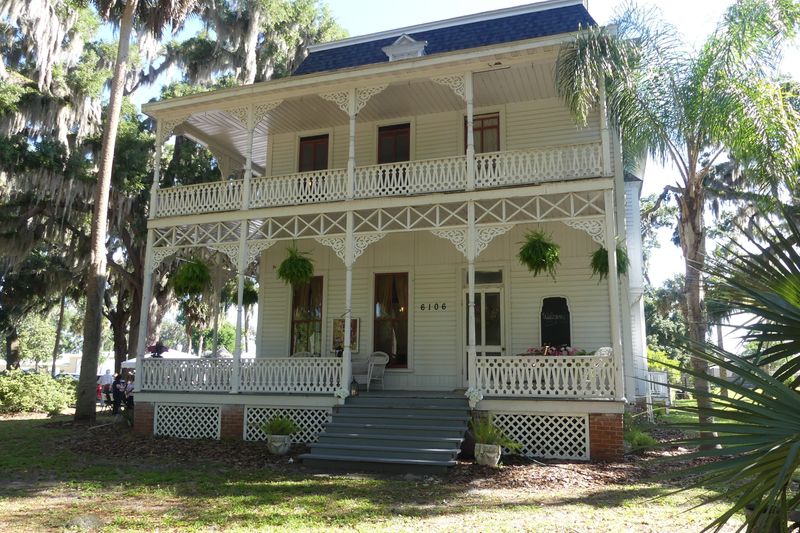 The two-story Baker House was built in the late 1800s. It features upper and lower wrap-around verandas on two floors, gingerbread trim, a separate building housing the dining room and kitchen and wide stairway leading to the front door. [Linda Florea/Correspondent]