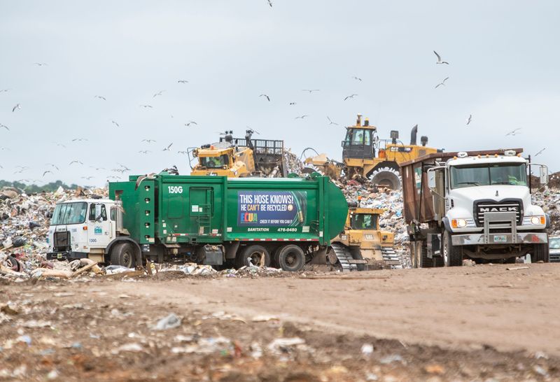 An ECUA truck gets set to empty a load at the Escambia County Waste Services Perdido Landfill on Wednesday, May 27, 2020.
