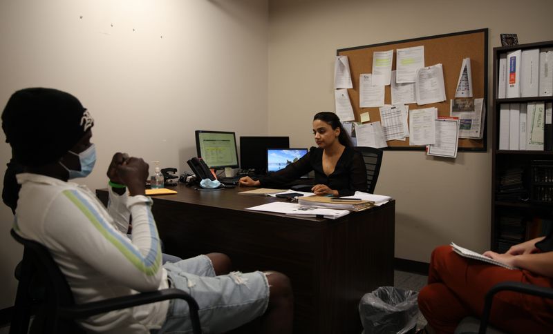 Hellai Noorzai, a former refugee and employee with Catholic Charities, helps several newly-arrived refugees find jobs in Jacksonville on Aug. 26, 2021.