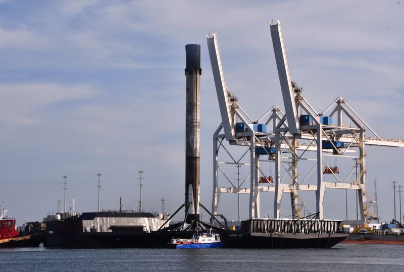 A SpaceX Falcon 9 first-stage booster arrives at Port Canaveral in August 2021 on the SpaceX drone ship A Shortfall of Gravitas.
