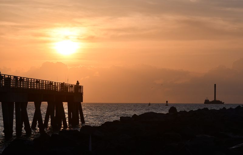 A SpaceX Falcon 9 booster approaches Port Canaveral just after sunrise in August 2021 on the SpaceX drone ship A Shortfall of Gravitas.