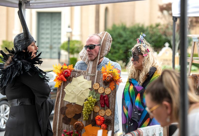 Shoppers check out the festivities during the Palafox Halloween Market in Downtown Pensacola Saturday, October 30, 2021.