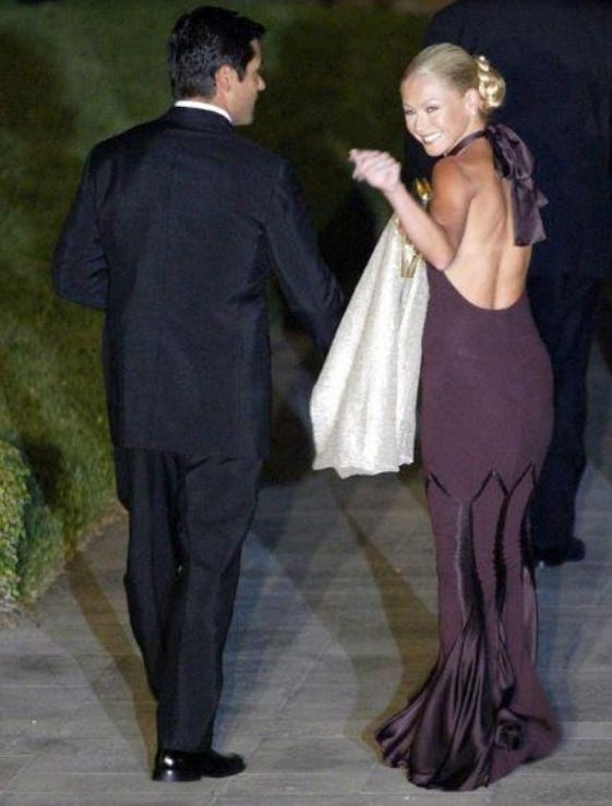 Kelly Ripa and her husband, actor Mark Consuelos, enter the church for Donald Trump’s wedding to Melania Knauss on Jan. 25, 2005, in Palm Beach, Florida. (Damon Higgins/The Palm Beach Post)