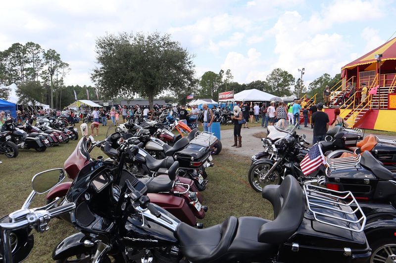 Bikers walk around the Cacklebery Campground during Bike Week in 2023.